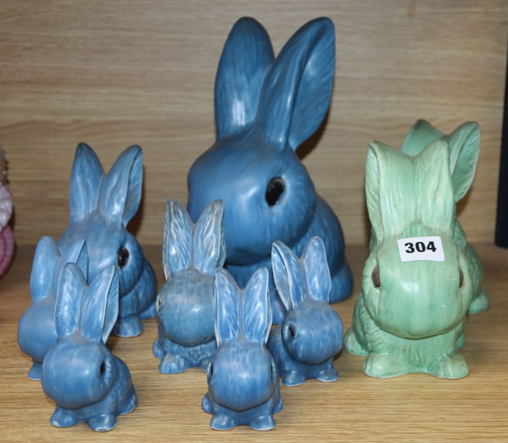 Seven blue Sylvac rabbits and two green rabbits, tallest 25cm